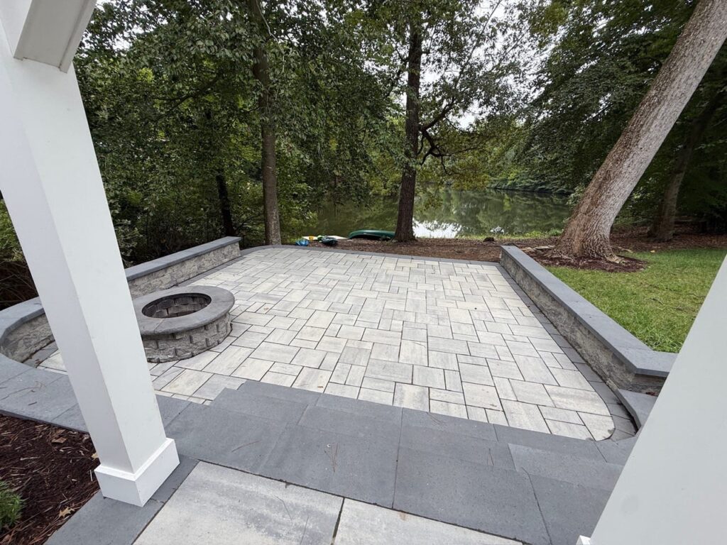 View from the pergola to a paver fire pit patio