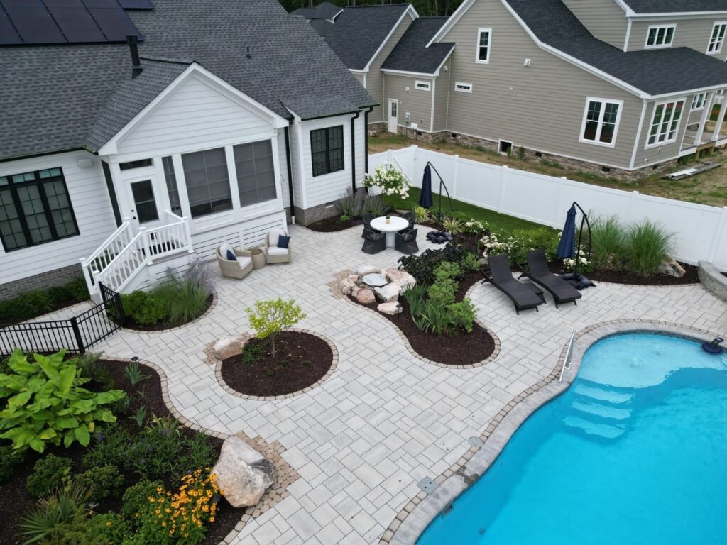Pool with paver deck, lounge chairs and planting islands in Tabb, VA